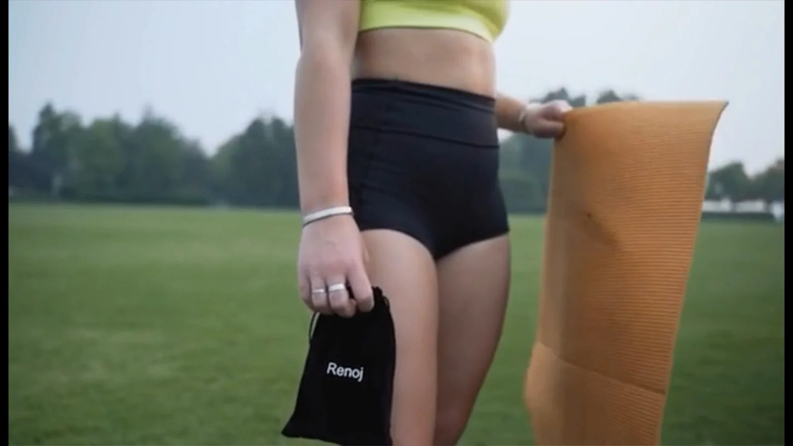 The whole gym fits in one hand: a mat, a pouch, five loops.